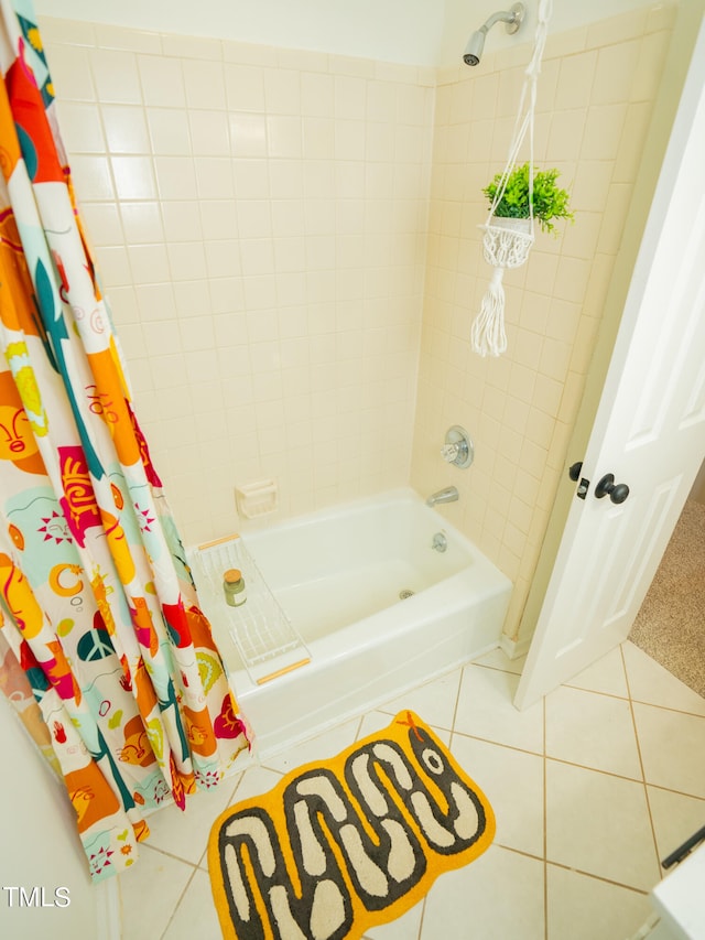 bathroom featuring tile patterned flooring and shower / bathtub combination with curtain