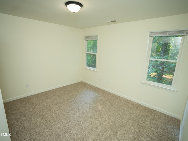 unfurnished room with carpet flooring