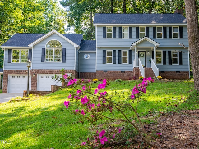 colonial-style house with a garage and a front yard