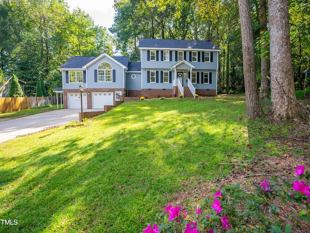 colonial house with a garage and a front lawn