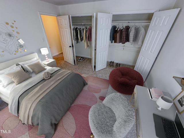 bedroom featuring two closets and carpet