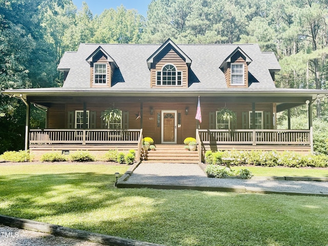 view of front of house featuring a front lawn and covered porch