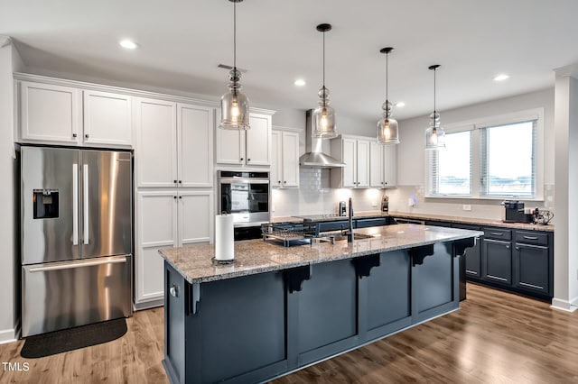 kitchen with stainless steel appliances and white cabinets