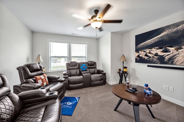 carpeted living room featuring ceiling fan