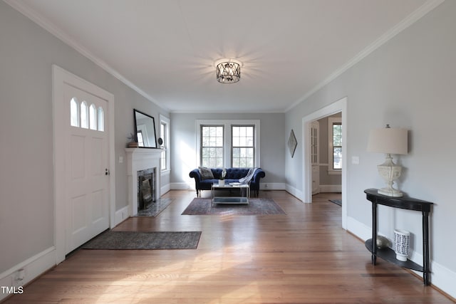 living room featuring crown molding and hardwood / wood-style flooring