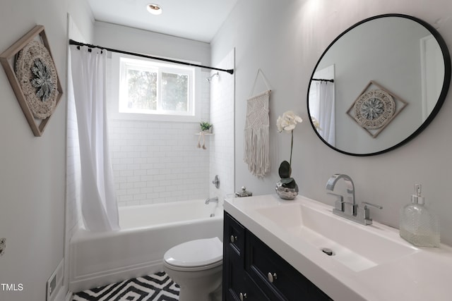 full bathroom featuring vanity, shower / bath combination with curtain, and toilet