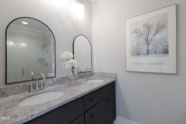 bathroom featuring vanity, crown molding, and a shower with door