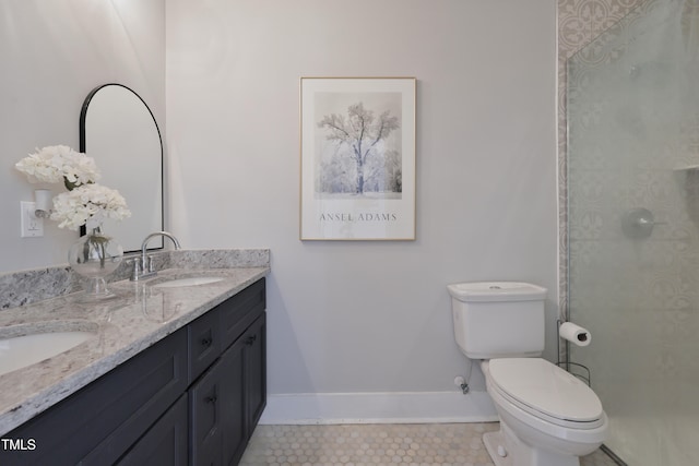 bathroom featuring vanity, toilet, tile patterned floors, and a shower with door