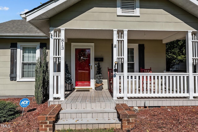 doorway to property featuring a porch