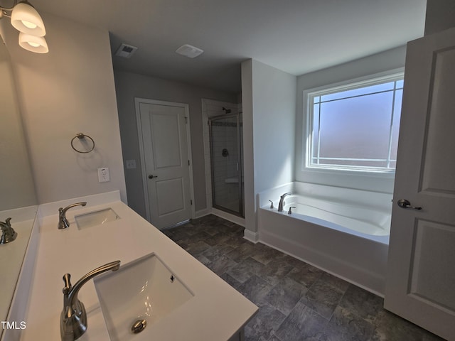 full bath featuring a garden tub, a sink, visible vents, and a shower stall