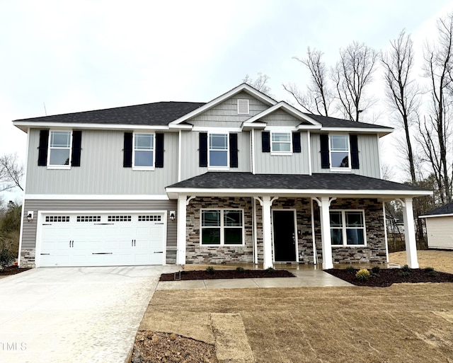 craftsman-style home with driveway, a porch, stone siding, a garage, and board and batten siding