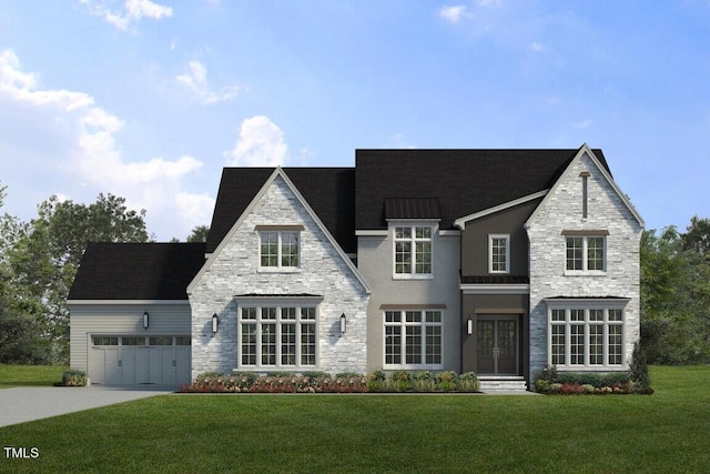 view of front of house featuring a garage and a front lawn