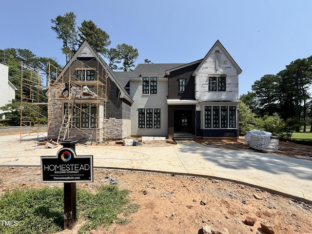 7000 N Ridge Dr, Raleigh, NC 27615 - view of front facade featuring stone siding and stucco siding