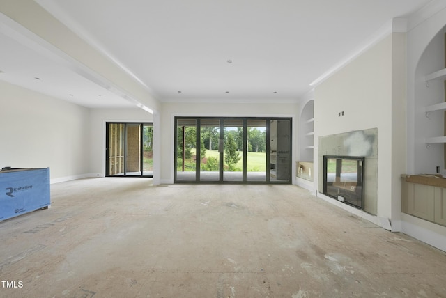 7000 N Ridge Dr, Raleigh, NC 27615 - unfurnished living room featuring built in shelves, a glass covered fireplace, and ornamental molding