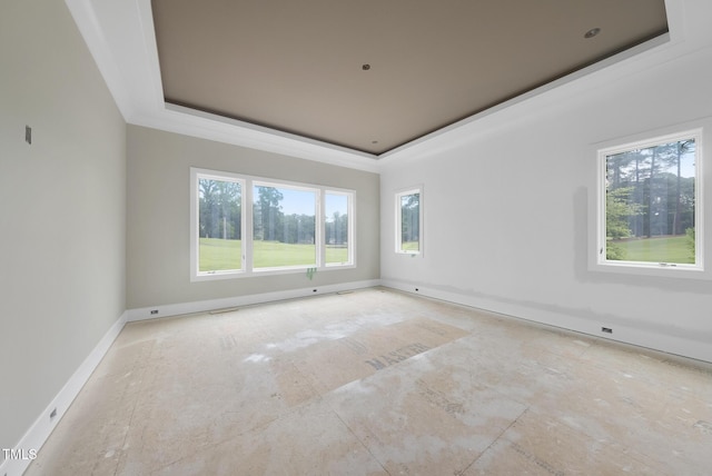 7000 N Ridge Dr, Raleigh, NC 27615 - empty room featuring a tray ceiling and baseboards