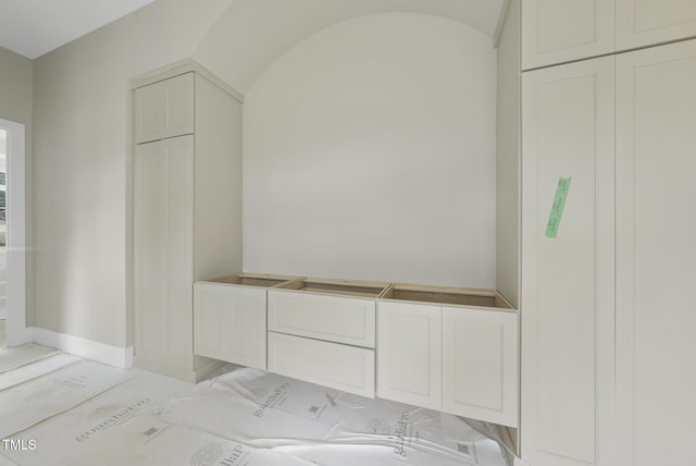 7000 N Ridge Dr, Raleigh, NC 27615 - mudroom featuring baseboards and lofted ceiling