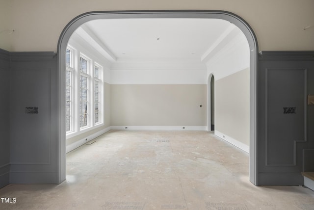 7000 N Ridge Dr, Raleigh, NC 27615 - spare room featuring arched walkways and a raised ceiling
