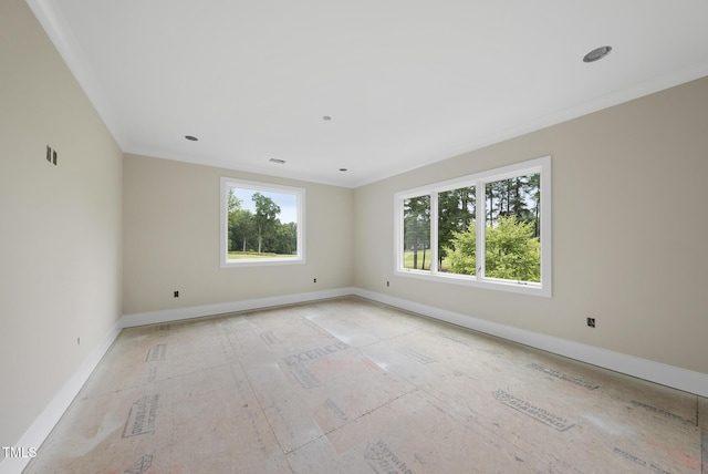 7000 N Ridge Dr, Raleigh, NC 27615 - spare room featuring baseboards and crown molding