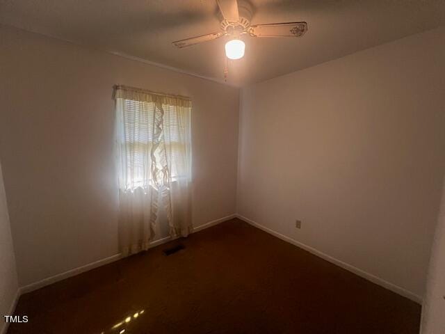 unfurnished room with ceiling fan