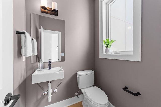 bathroom with sink and toilet