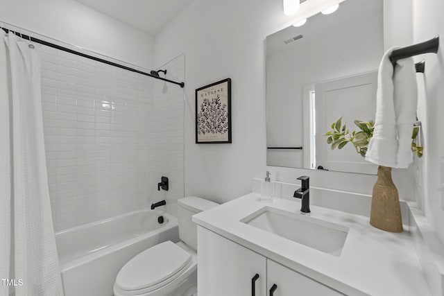 full bathroom with shower / bathtub combination with curtain, vanity, and toilet