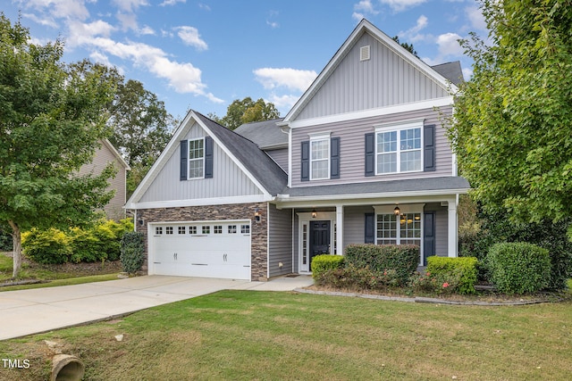 craftsman-style house with a porch, a garage, and a front yard