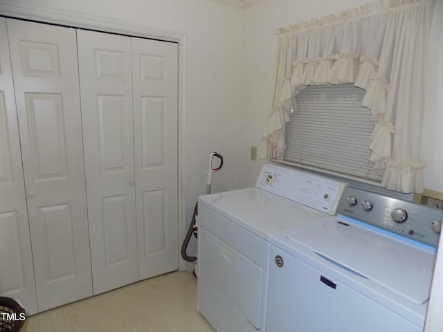 clothes washing area featuring independent washer and dryer