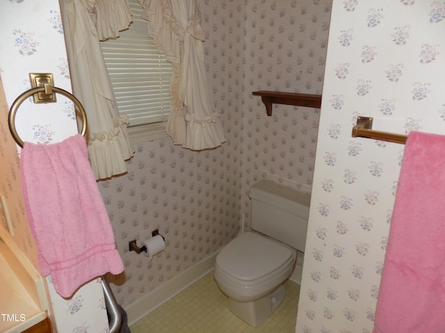 bathroom featuring toilet and tile patterned floors