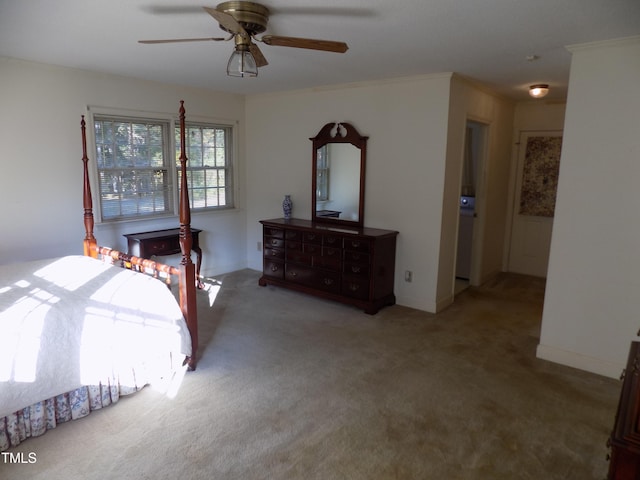 bedroom with ornamental molding, carpet flooring, and ceiling fan