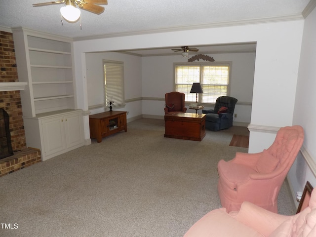 carpeted living room with ornamental molding, a textured ceiling, and ceiling fan