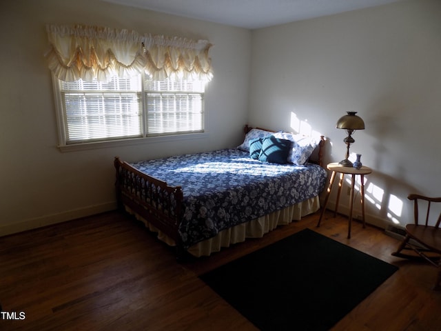 bedroom with wood-type flooring