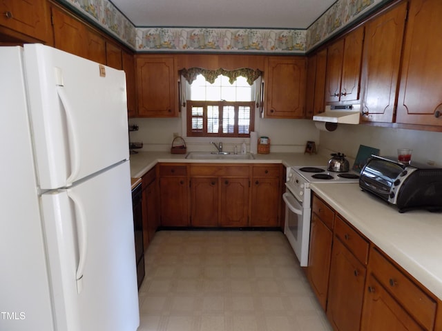 kitchen with extractor fan, sink, and white appliances