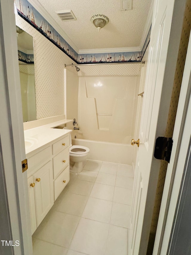 full bathroom with vanity, a textured ceiling, tile patterned flooring, toilet, and washtub / shower combination