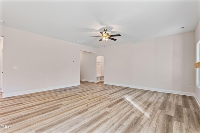 spare room featuring light hardwood / wood-style floors and ceiling fan