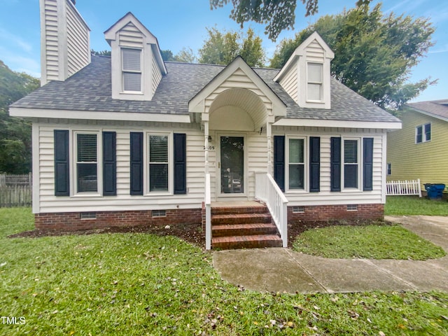 cape cod-style house featuring a front lawn