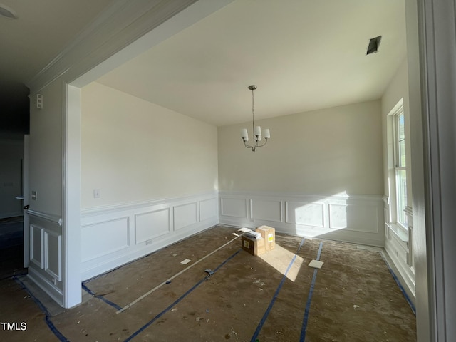 unfurnished dining area with an inviting chandelier