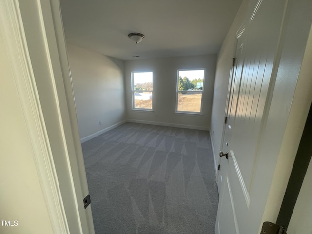 empty room with carpet flooring