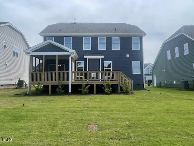 1528 Maelyn Way, Fuquay Varina, NC 27526 - back of house featuring a sunroom, central AC unit, a lawn, and a wooden deck