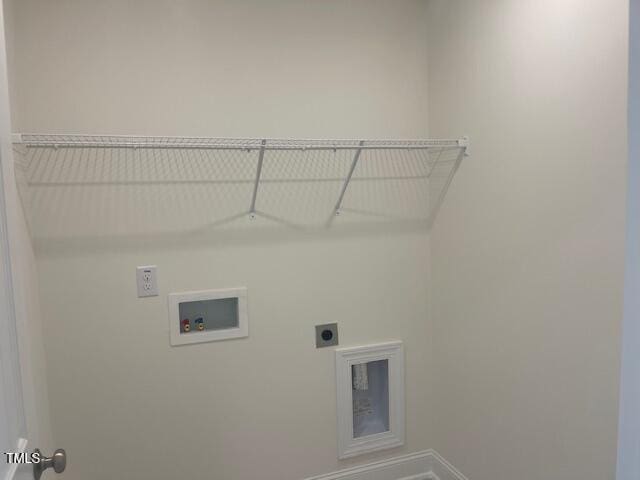 1528 Maelyn Way, Fuquay Varina, NC 27526 - laundry area featuring electric dryer hookup, hookup for a washing machine, and baseboards