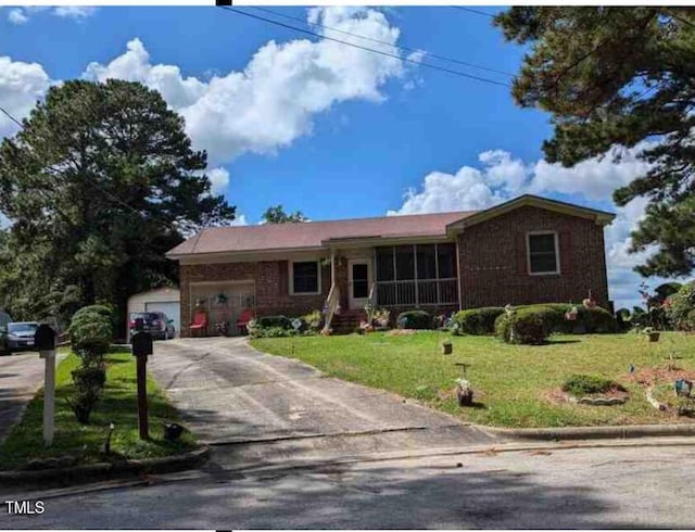 ranch-style house with a garage and a front lawn