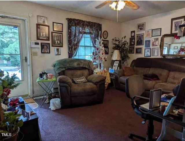 living room featuring carpet floors and ceiling fan