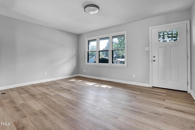 entryway with light hardwood / wood-style floors