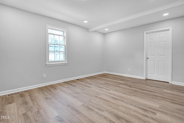 spare room featuring light wood-type flooring