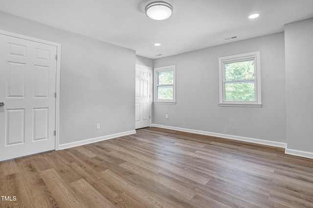 unfurnished room featuring light wood-type flooring