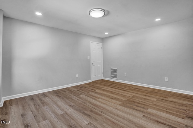 spare room featuring light hardwood / wood-style flooring