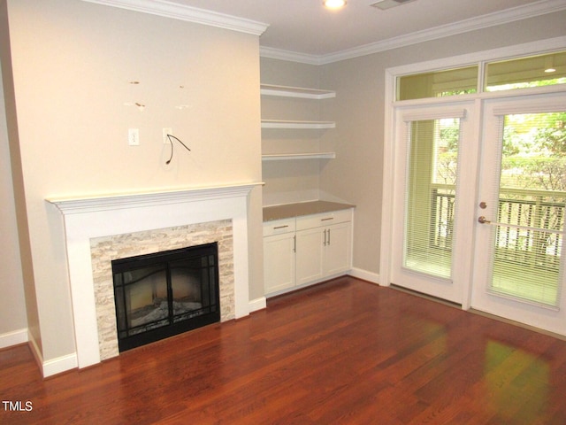 unfurnished living room featuring crown molding and dark hardwood / wood-style floors