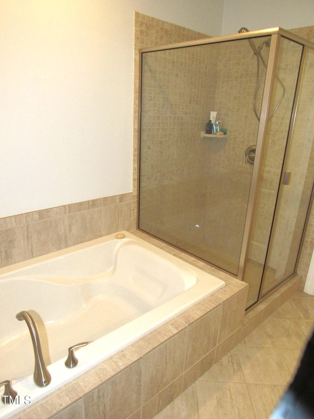 bathroom with separate shower and tub