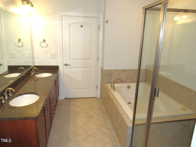 bathroom featuring independent shower and bath and vanity