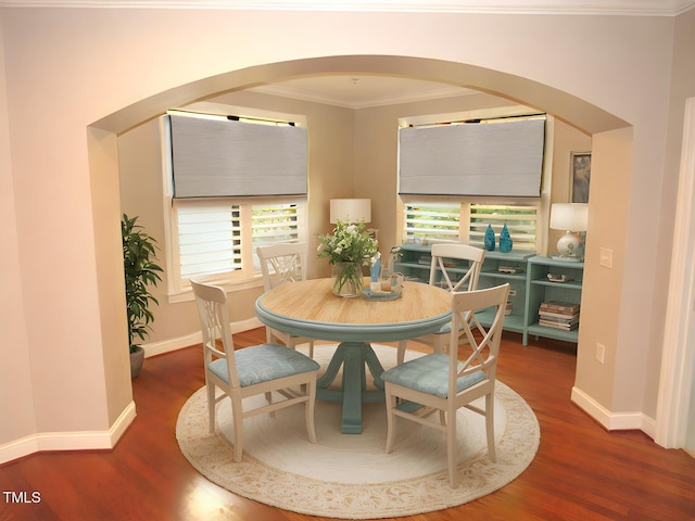 dining room featuring crown molding and hardwood / wood-style floors