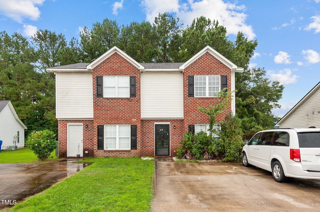 view of front of home with a front lawn